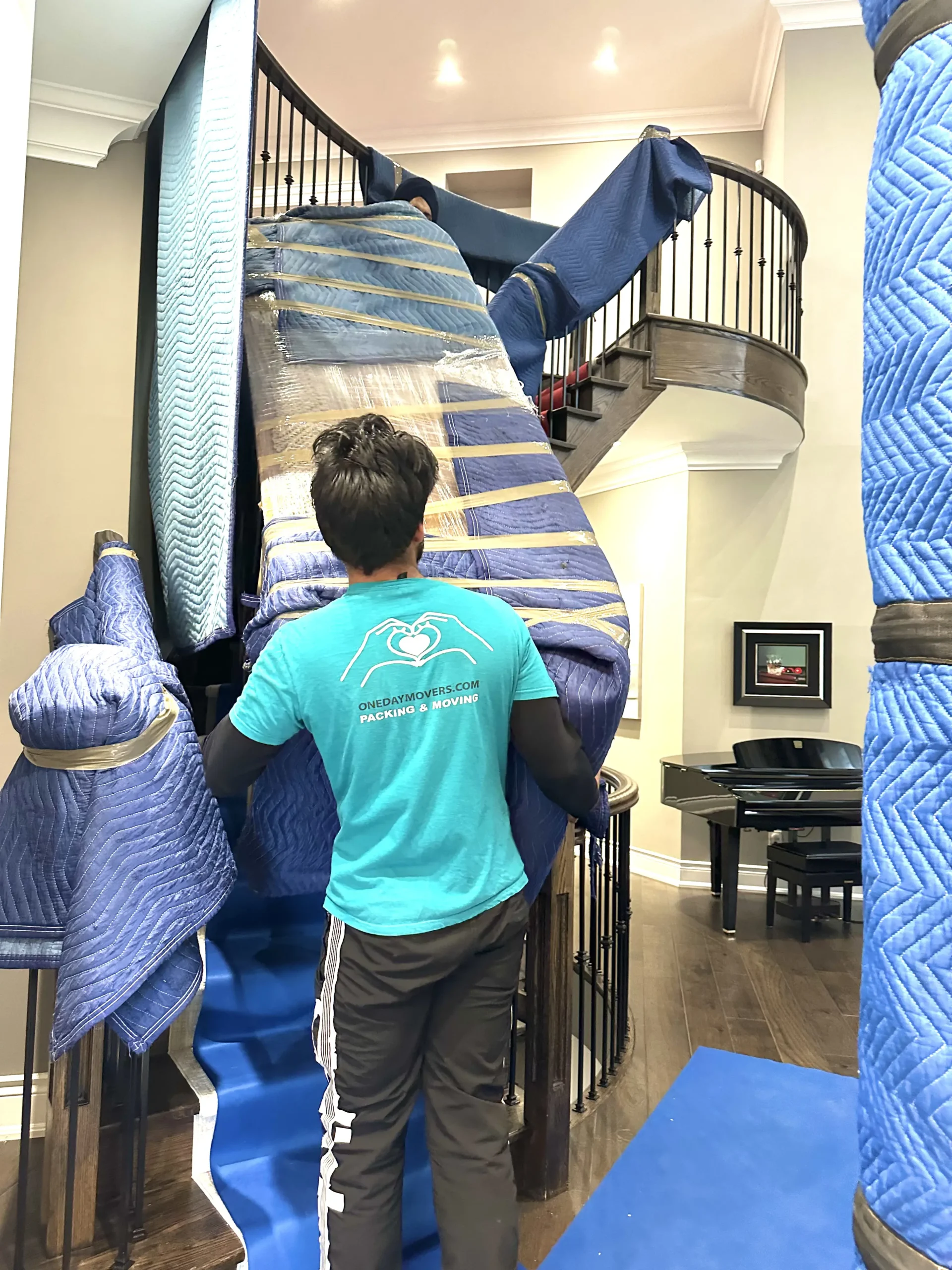 Movers rearranging furniture during in-house move Toronto