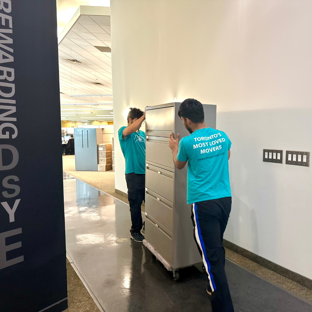 Corporate event movers handling office equipment in Toronto