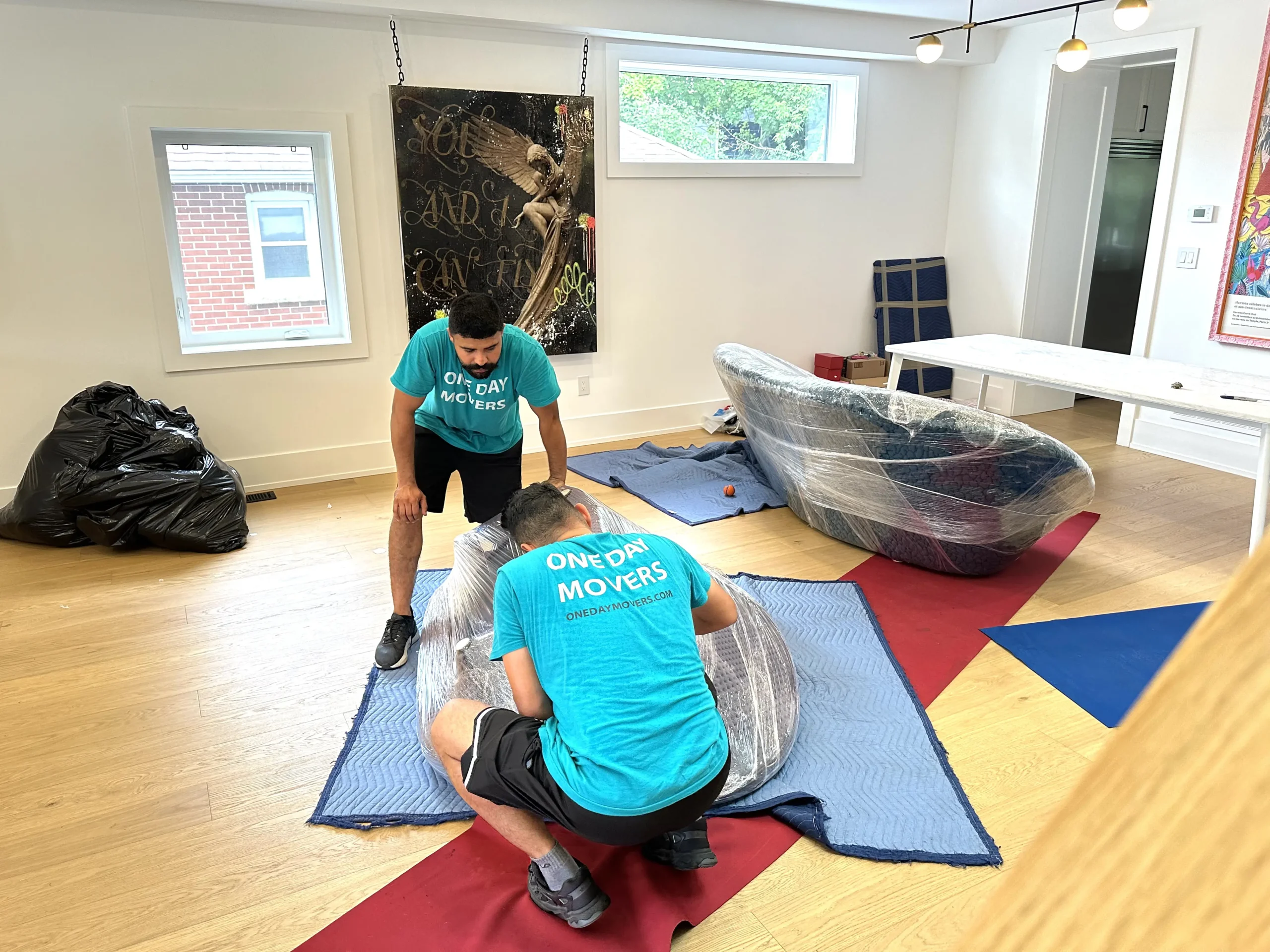 Professional white glove movers handling delicate items